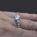 Shared Prong Antique Style Engagement Ring with Large Graduated Diamonds On the Finger